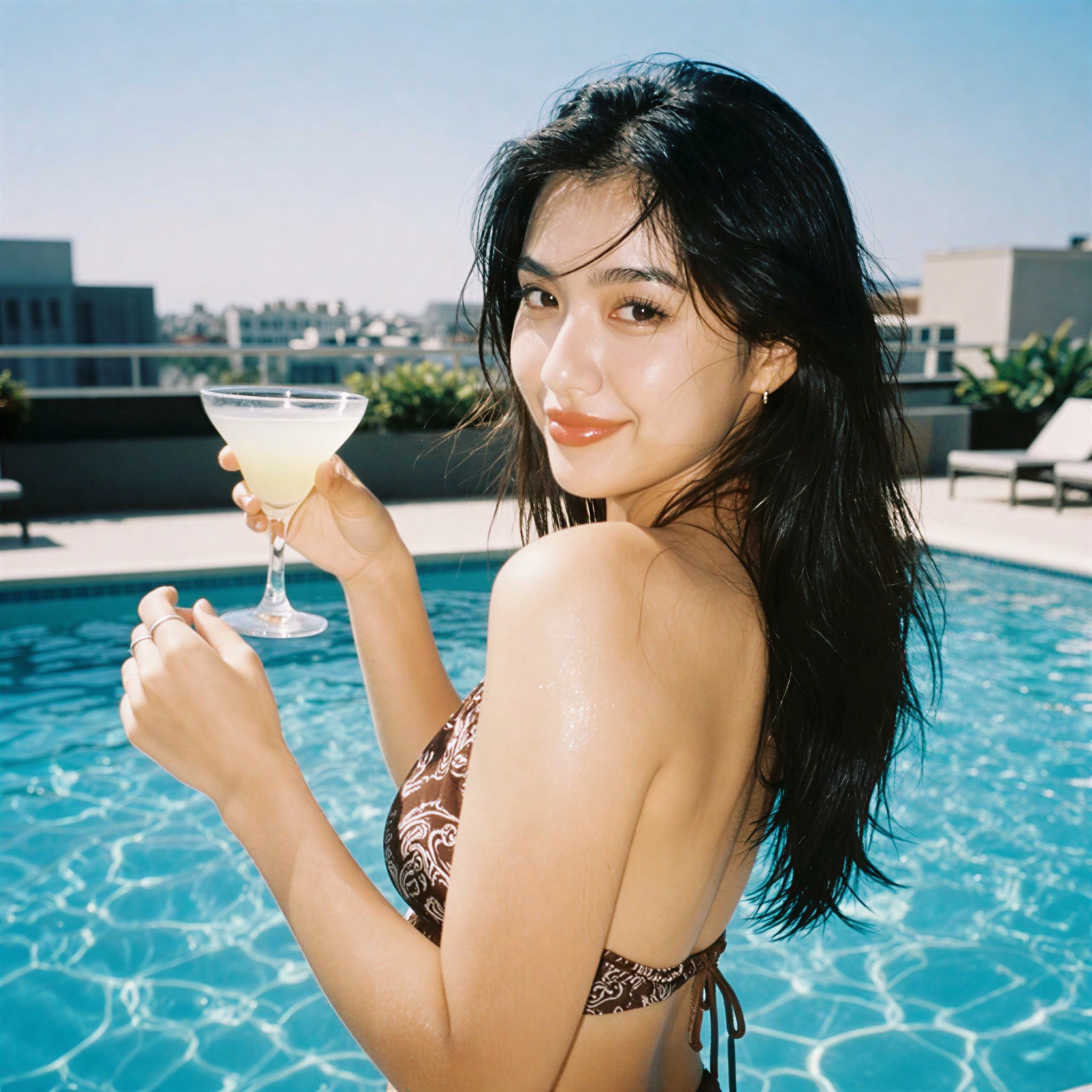 Create image: A candid disposable-camera snapshot of the same subject in the attached image. The subject is standing beside a rooftop pool during bright daytime